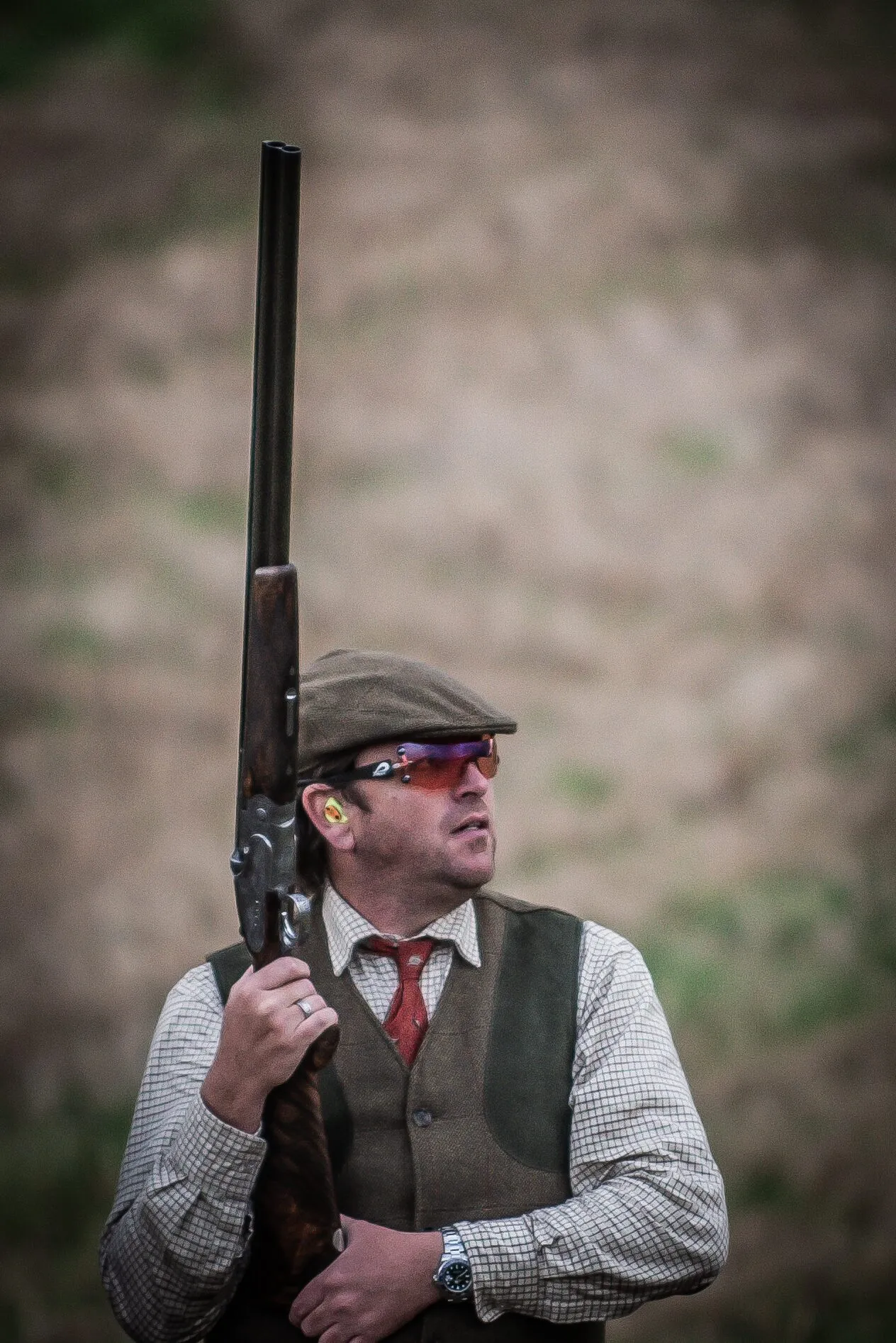 A formally dressed man outdoors at a special occasion